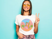 Load image into Gallery viewer, cute girl with yellow hippie glasses holding a peace sign wearing her Aries Zodiac T-shirt
